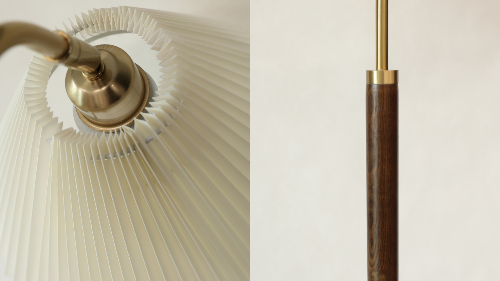 Close-up of a floor lamp with white shade and gold finish, and a wooden and metal light fixture.